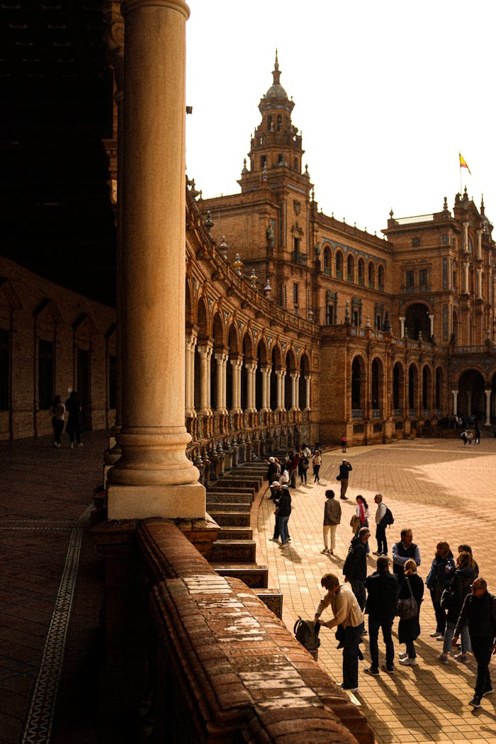services-02 Visitors at the historic Plaza de España in Seville, capturing its majestic architecture and lively atmosphere.
